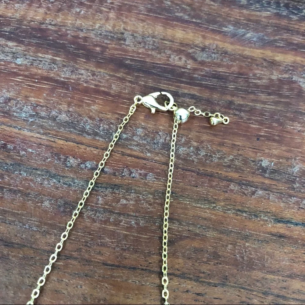 gold dangle station necklace encrusted clover charm round bezel set Cubic Zircon